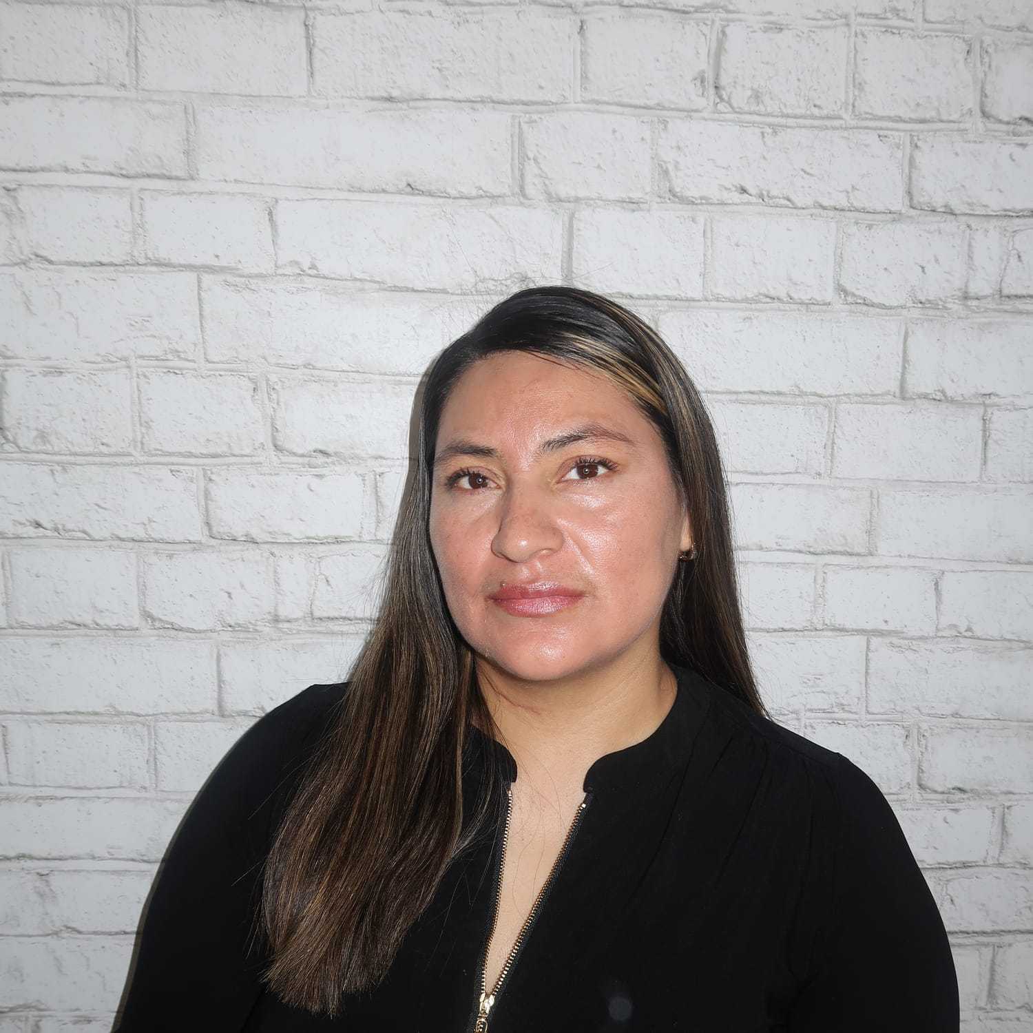 Portrait of Diana Meza, a professional stylist at Avalon Salon for Hair and Nails, showcasing their expertise and style.
