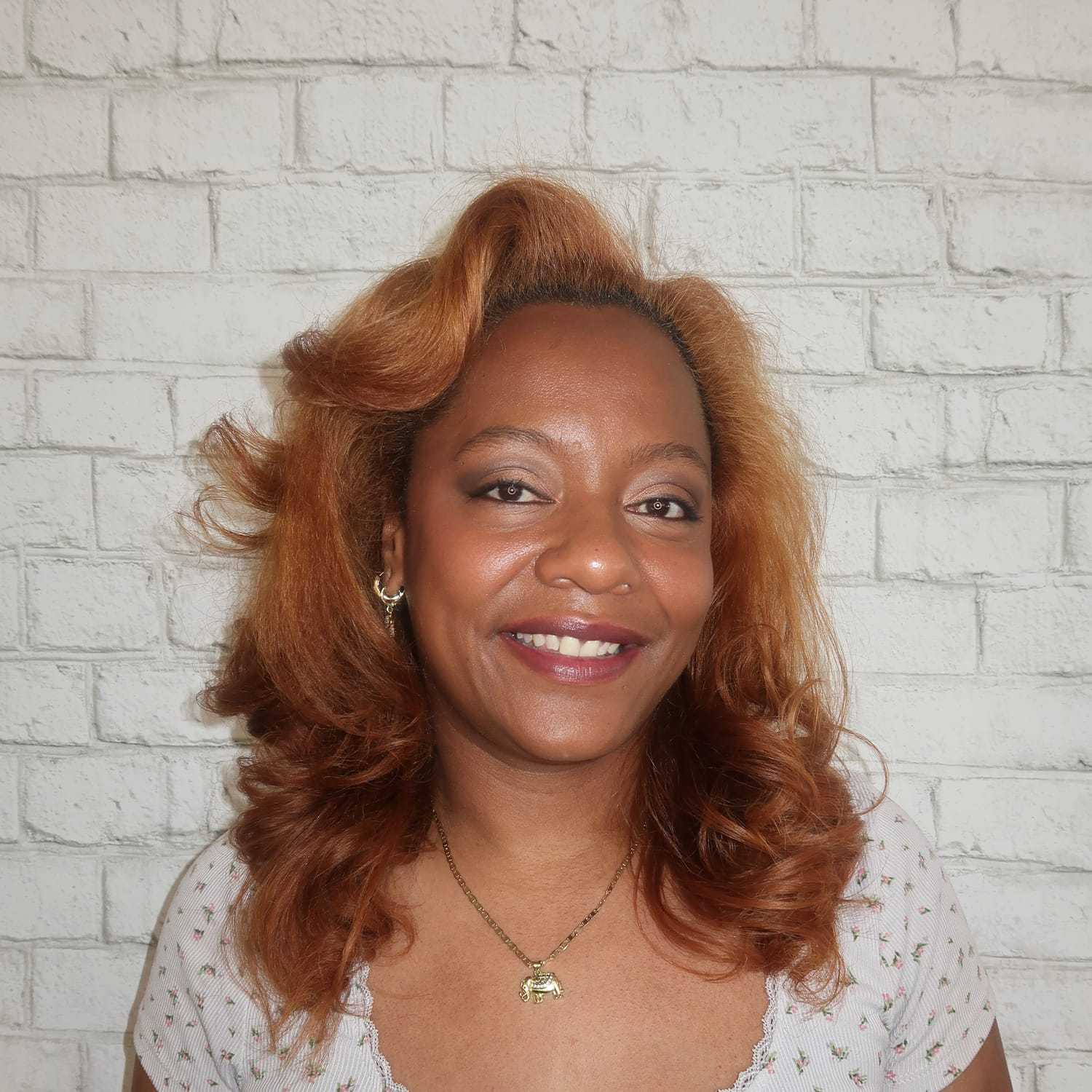Portrait of Jessica Bolanos, a professional stylist at Avalon Salon for Hair and Nails, showcasing their expertise and style.