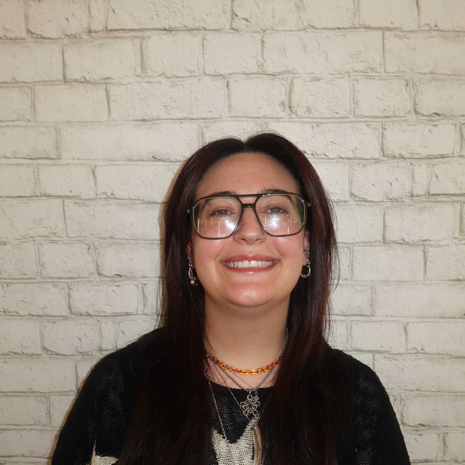 Portrait of Marla Schweighardt, a professional stylist at Avalon Salon for Hair and Nails, showcasing their expertise and style.