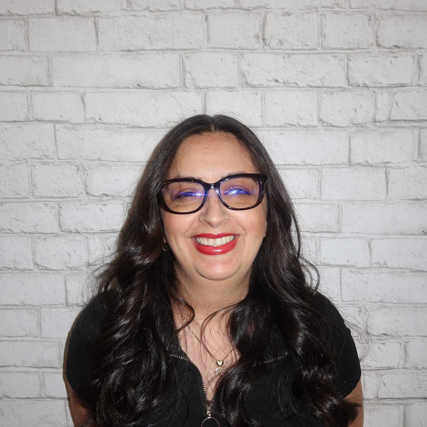 Portrait of Jeimy Jimenez Salas, a professional stylist at Avalon Salon for Hair and Nails, showcasing their expertise and style.