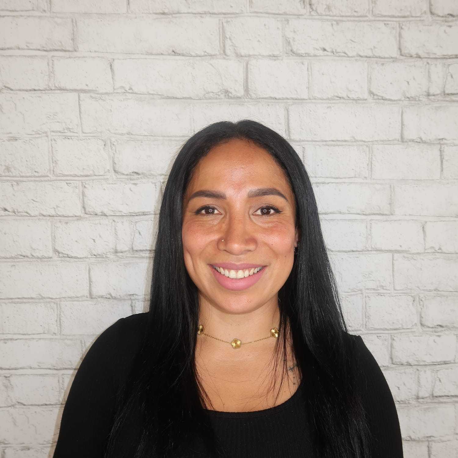 Portrait of Valeria Pesantez, a professional stylist at Avalon Salon for Hair and Nails, showcasing their expertise and style.