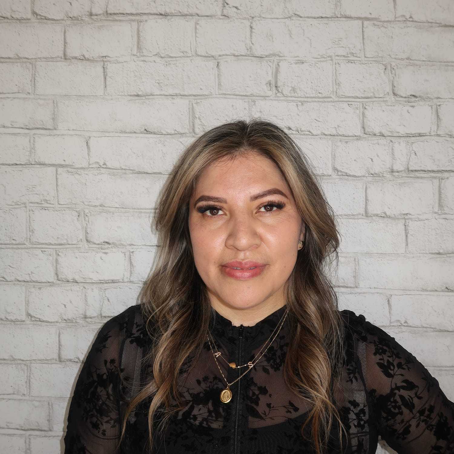 Portrait of Alex Ganan, a professional stylist at Avalon Salon for Hair and Nails, showcasing their expertise and style.